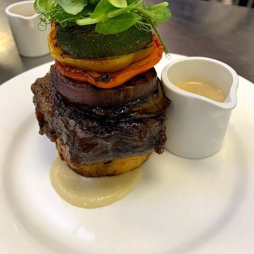 Feather-blade steak with chargrilled vegetables, whiskey cream sauce, shallot puree and a crushed potato cake