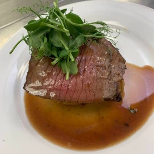 Roast sirloin of beef with madeira jus and served with dauphinoise potatoes     