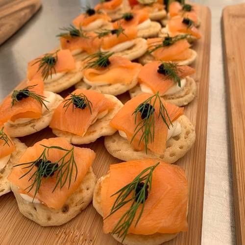 Salmon Blinis topped with caviar & dill