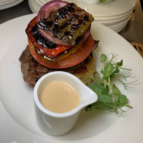 Feather-blade steak with chargrilled vegetables, whiskey cream sauce, shallot puree and a crushed potato cake