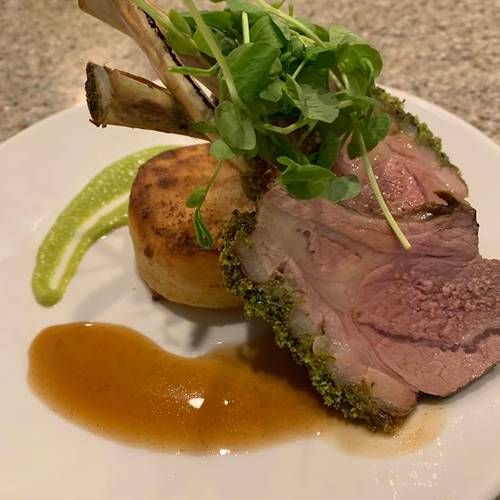 Herb crusted rack of lamb, pea puree, rosemary jus and fondant potatoes